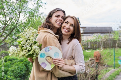 Teenage son congratulating mom on Mother's Day photo