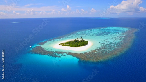 Small romantic island in the pacific ocean, Maldives, reefs, blue ocean, palm trees