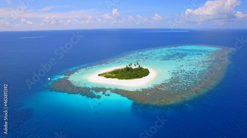Small romantic island in the pacific ocean, Maldives, reefs, blue ocean, palm trees