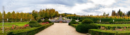 Royal Palace of La Granja de San Ildefonso. Panoramic the Royal Palace of La Granja de San Ildefonso. Gardens and fountains throughout the enclosure full of flowers and colorful leaves in the fall. photo