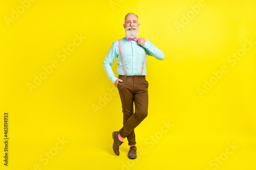 Full length body size photo gentleman wearing stylish clothes at party isolated vivid yellow color background
