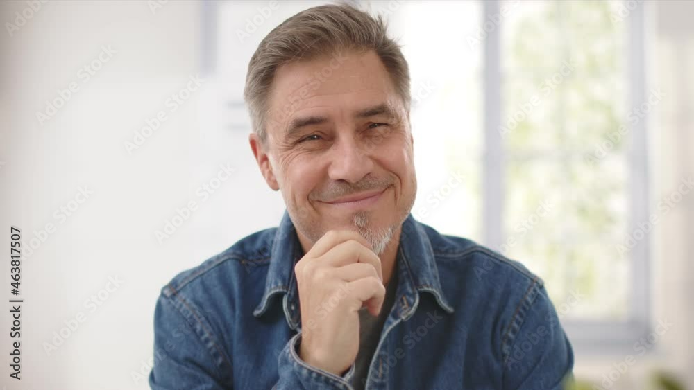 Portrait of mature age, middle age, mid adult casual man in 50s, happy confident smile. White background, copy space. Portrait of mature age, middle age, mid adult casual man in 50s, happy confident smile. White background, copy space.