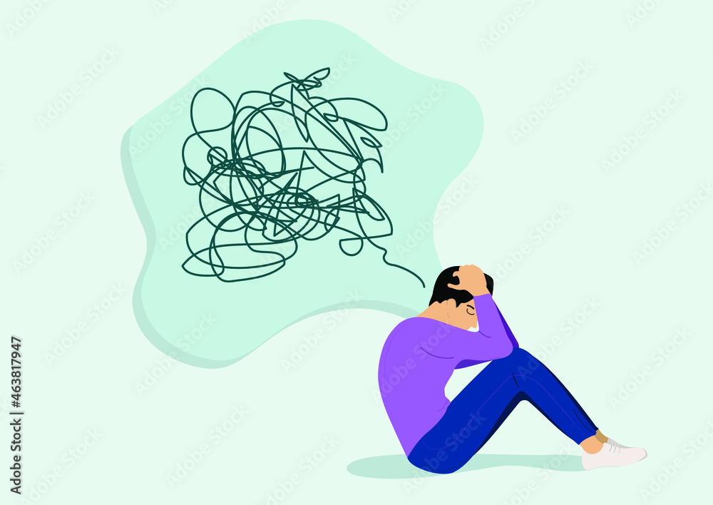 An unhappy man suffering from a mental health illness sitting on the