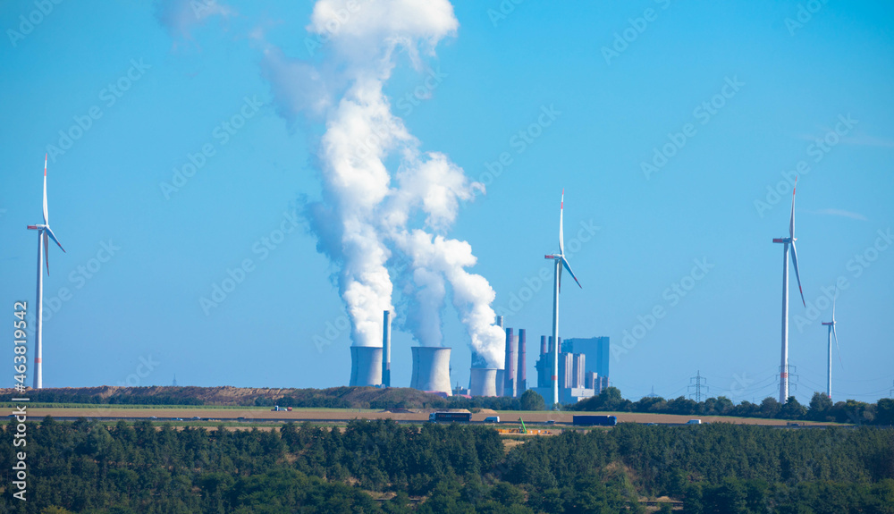 Panoramic view of coal-fired power station with smoking cooling towers. Neurath North Rhine Westphalia, Germany