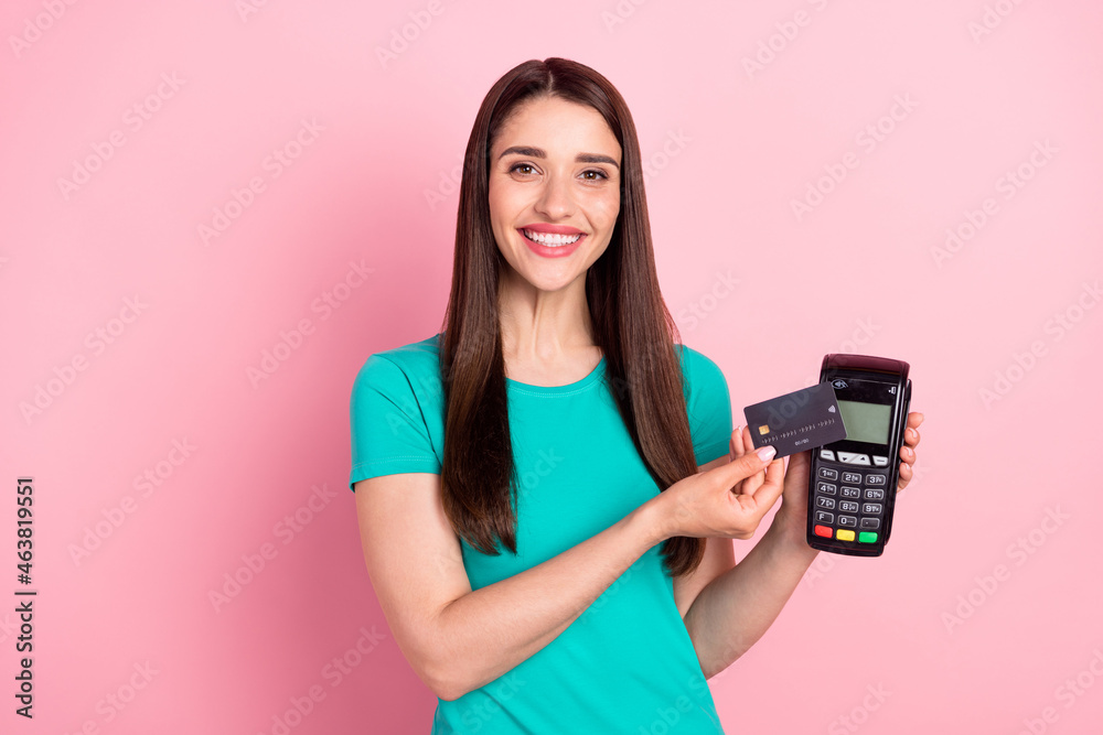 Photo of young woman happy positive smile make payment atm credit card shop isolated over pink color background Photo of young woman happy positive smile make payment atm credit card shop isolated over pink color background