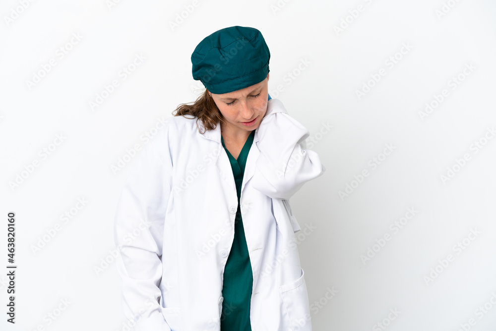 Surgeon caucasian woman in green uniform isolated on white background with neckache Surgeon caucasian woman in green uniform isolated on white background with neckache