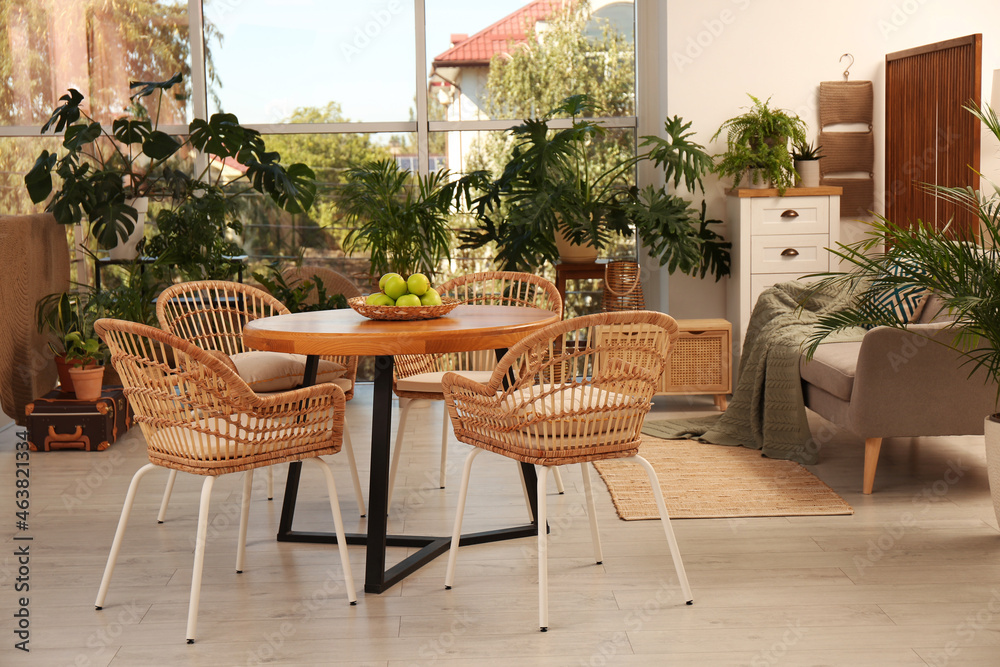 Fototapeta premium Stylish living room with beautiful plants. Interior design