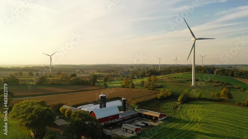 Country autumn landscape with windmills, farm ranch, agricultural corn field. Aerial overhead view. Midwest USA