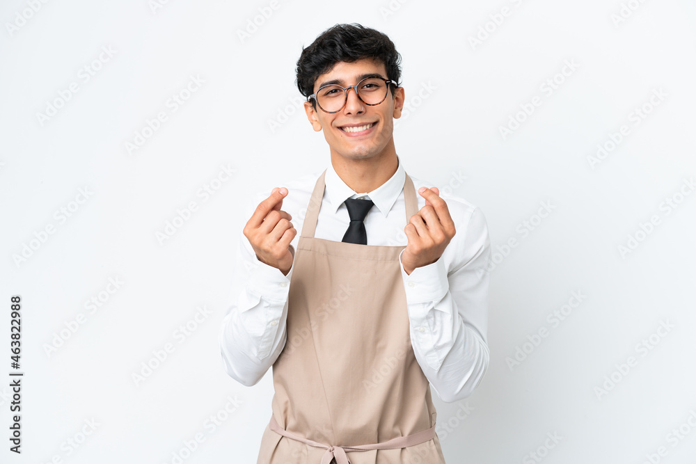 Restaurant Argentinian waiter isolated on white background making money gesture Restaurant Argentinian waiter isolated on white background making money gesture
