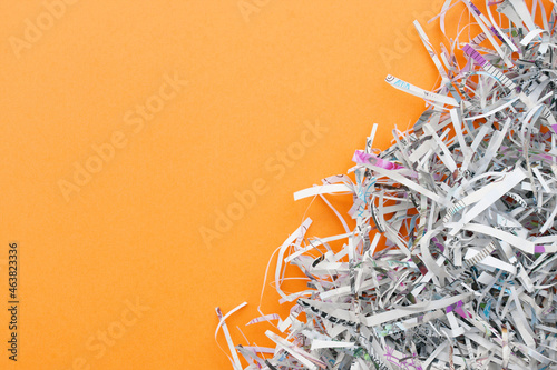 Fotografía The shredded paper on light orange background.
