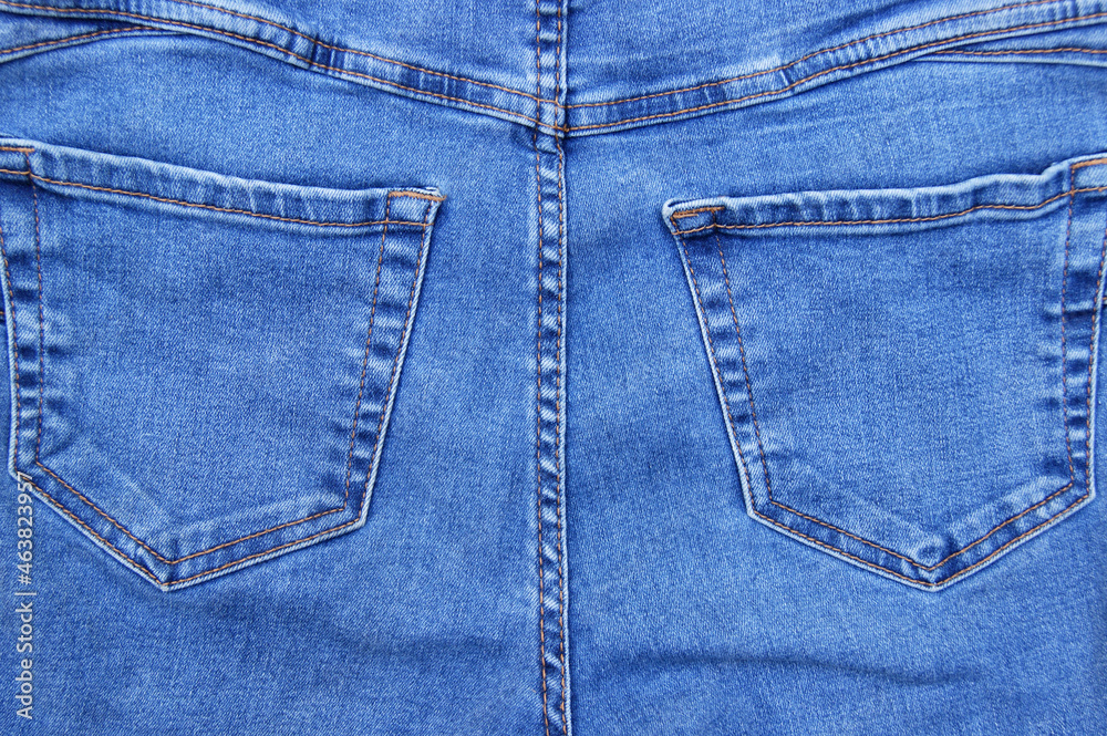 Flat lay, denim jeans leg seam detail, background texture. Flat lay, denim jeans leg seam detail, background texture.