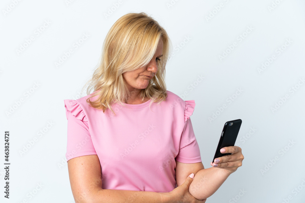 Middle age using mobile phone isolated on white background with sad expression Middle age using mobile phone isolated on white background with sad expression