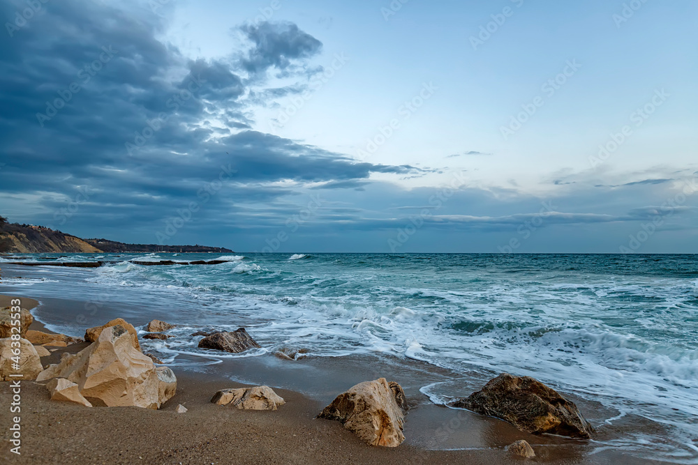 Beauty cloudy seascape with waves flowing between rocks. Beauty cloudy seascape with waves flowing between rocks.