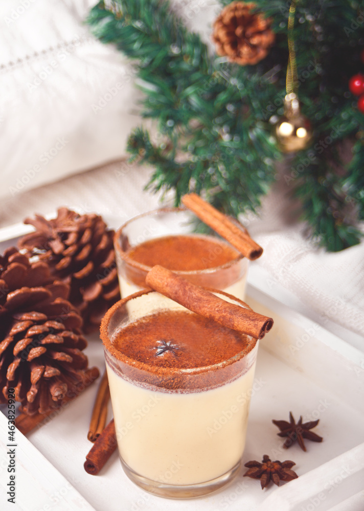 Glasses of holiday egg nog on the white tray Glasses of holiday egg nog on the white tray