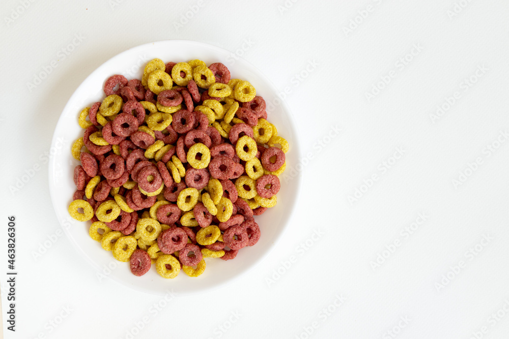 bowl of whole grain cereal rings breakfast isolated on white background bowl of whole grain cereal rings breakfast isolated on white background