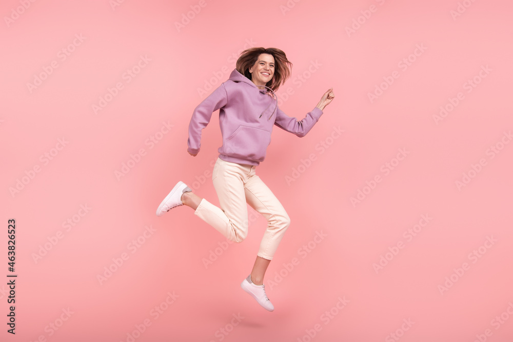 Full body profile side photo of mature woman happy positive smile run jump hurry sale isolated pink color background