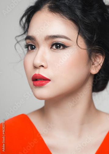 Fashion portrait of asian woman with elegant hairstyle. Perfect makeup.