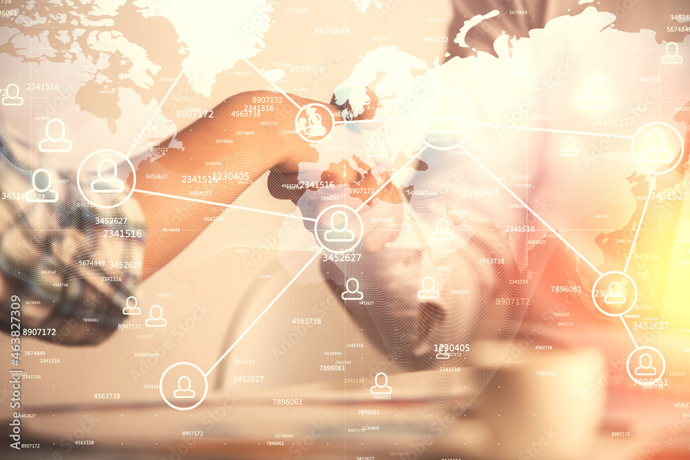 Fototapeta premium Double exposure of social network theme hologram and handshake of two men.