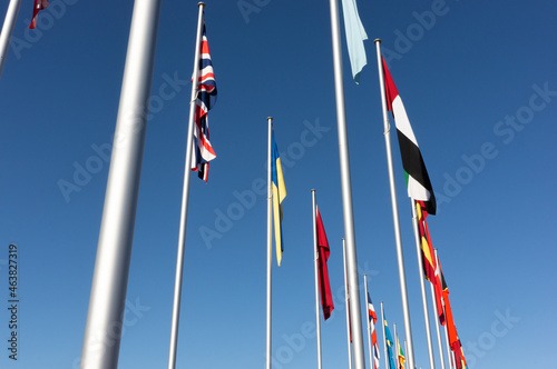 World flags display on a clear and calm day, with flags hanging downwards due to no wind
