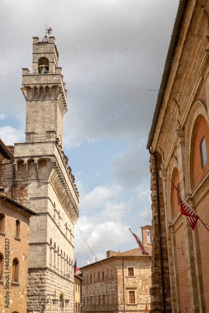 Montepulciano (SI), Italy - August 02, 2021: View of an old stone bell tower, Tuscany, Italy