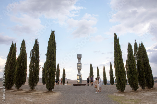 San Quirico d' Orcia (SI), Italy - August 05, 2021: Cypress row, better known as cipressini, near San Quirico d' Orcia, Tuscany, Italy photo