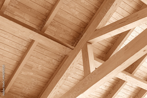 Fototapeta Naklejka Na Ścianę i Meble -  Wooden roof construction. Part of the floor of a wooden house.