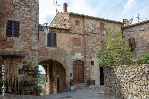 Fototapeta Naklejka Na Ścianę i Meble -  Castiglione d' Orcia (SI), Italy - August 10, 2021: Castiglione d' Orcia village and houses view, Tuscany, Italy