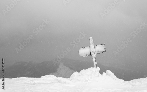 Snow-covered sign. Mountain winter landscape.