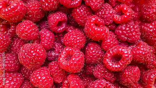 Texture background from a large number of raspberries.