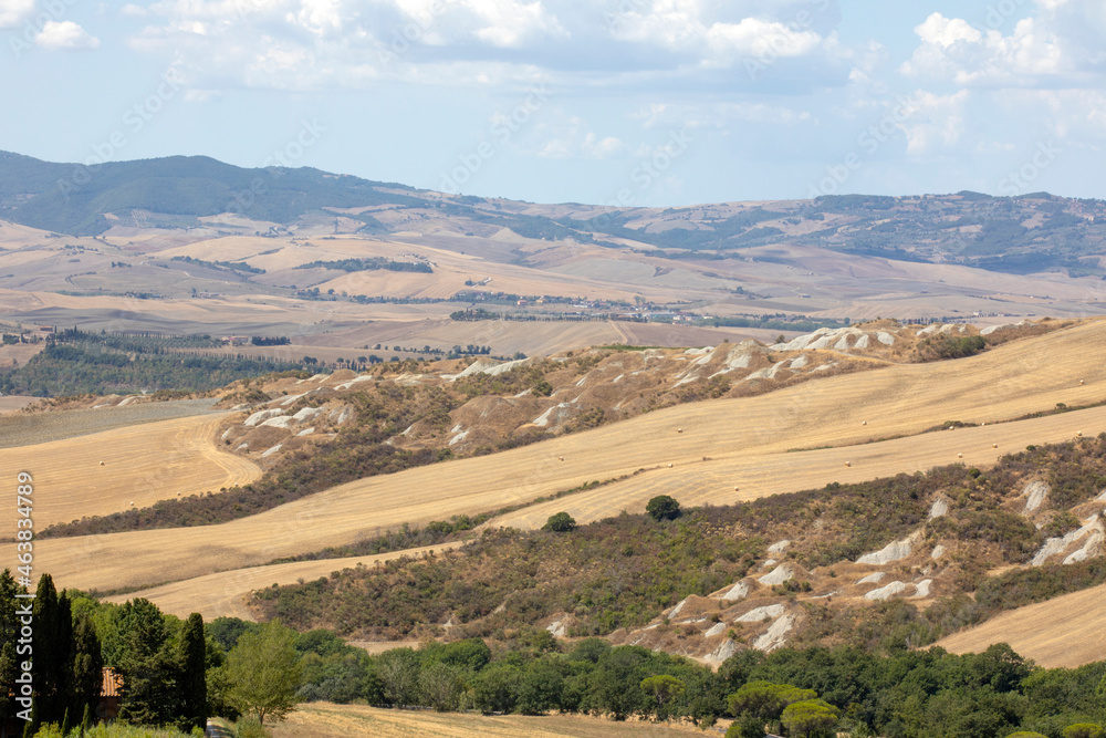 Val d' Orcia (SI), Italy - August 05, 2021: Typical landscape in val d' Orcia, Tuscany, Italy Val d' Orcia (SI), Italy - August 05, 2021: Typical landscape in val d' Orcia, Tuscany, Italy