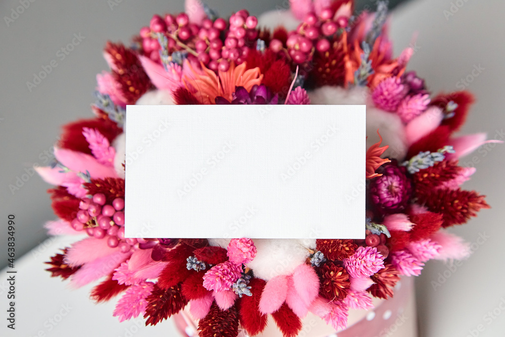 Business card or invitation mockup and dried flower bouquet