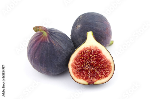 Fig fruit with ripe red half isolated on white
