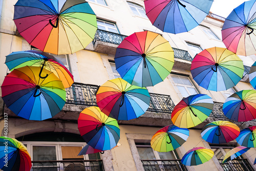 Street with hanged colorful umbrellas to decorate it
