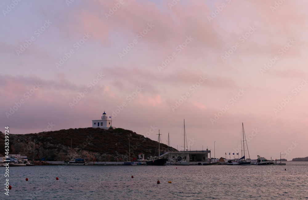 Greek Traditional Lighthouse And Pink Sunset Glow