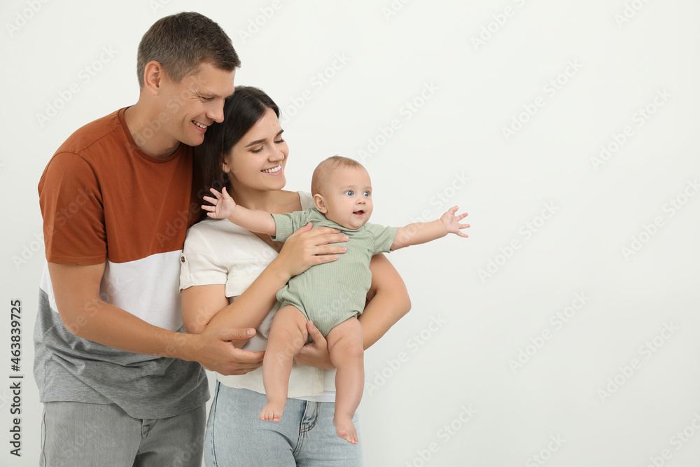 Portrait of happy family with their cute baby on white background Portrait of happy family with their cute baby on white background