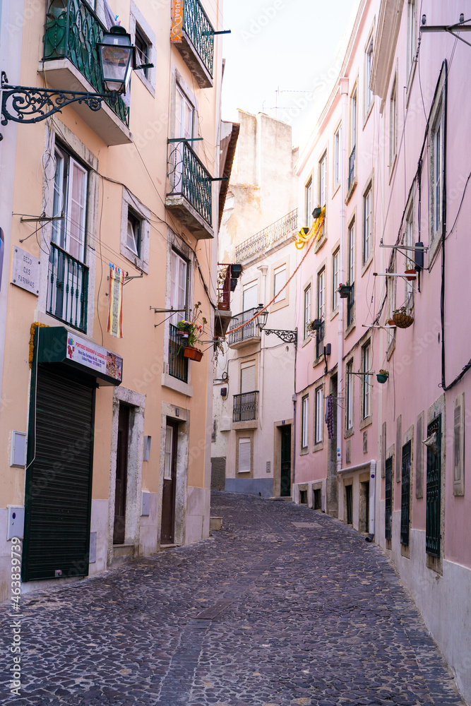 Street with pastel color facades and cobblestone street