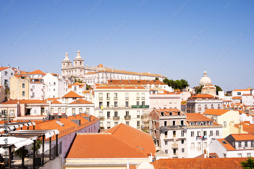 Panoramic view of the buildings of a downtown with an ancient monastery