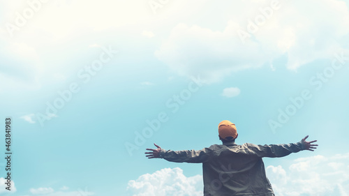 Photography Copy space of man rising hands on blue sky white clouds abstract background