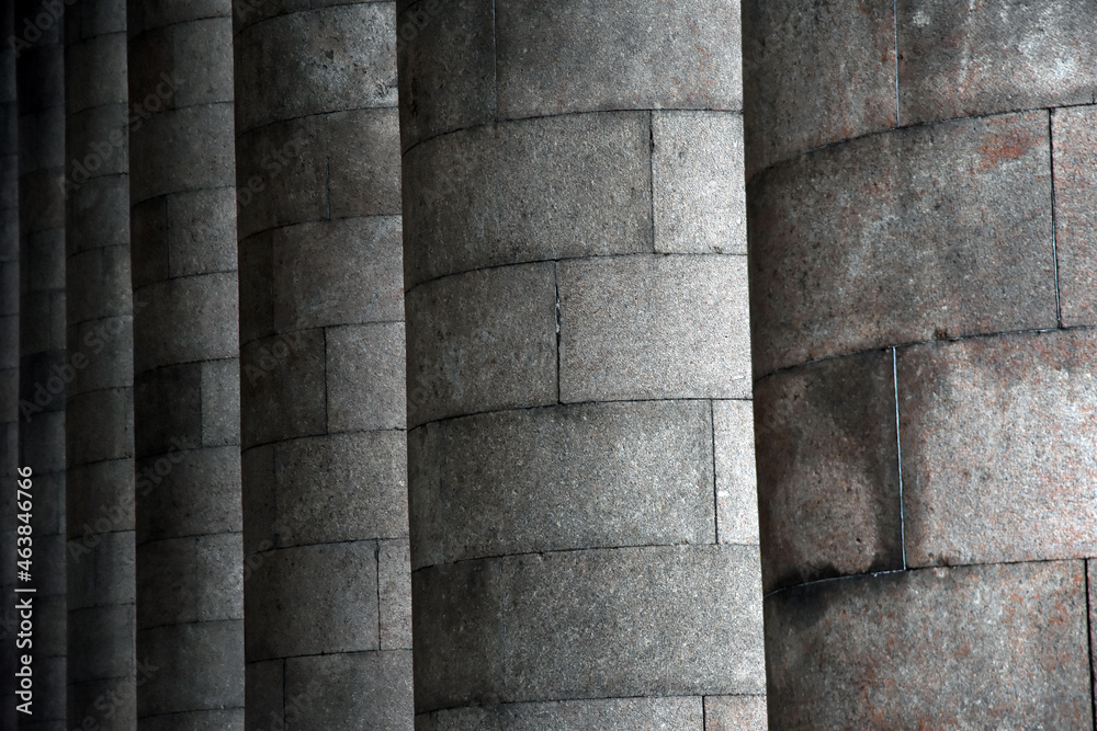 Columns in a row. Stone wall background Columns in a row. Stone wall background
