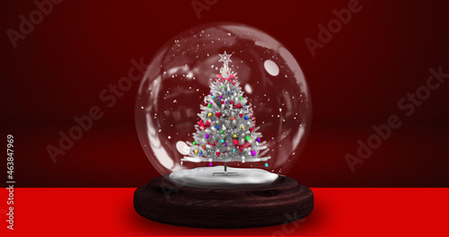 Image of snow globe over red background