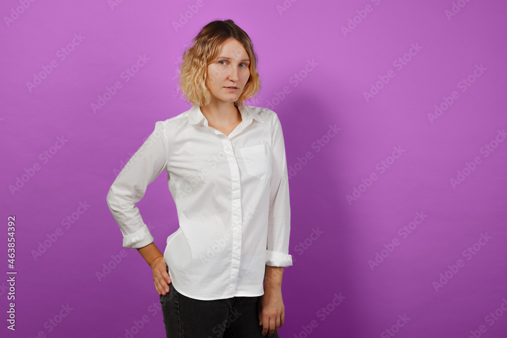 Woman posing in studio on pink solid background Woman posing in studio on pink solid background