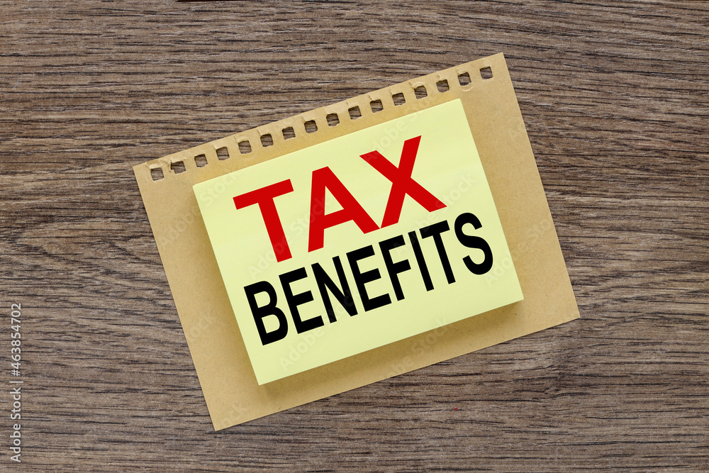 TAX BENEFITS. yellow office stickers. business concept TAX BENEFITS. yellow office stickers. business concept