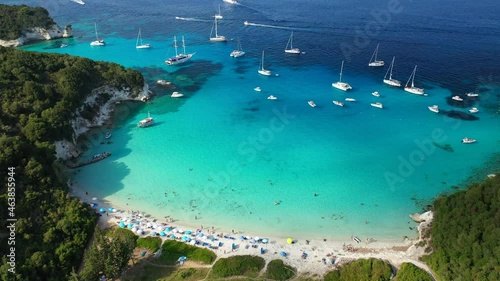 Aerial drone video of tropical paradise turquoise bay and sandy beach in popular Mediterranean destination island