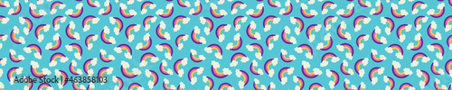 Seamless pattern with rainbows and clouds