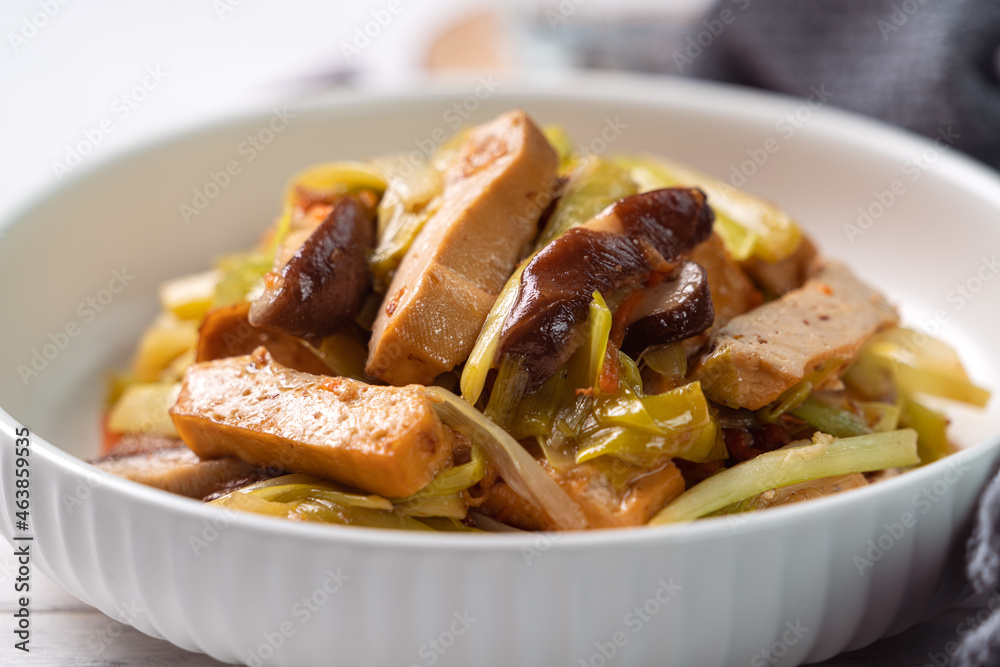 Homemade stir-fried dried beancurd with leek sprouts. Homemade stir-fried dried beancurd with leek sprouts.