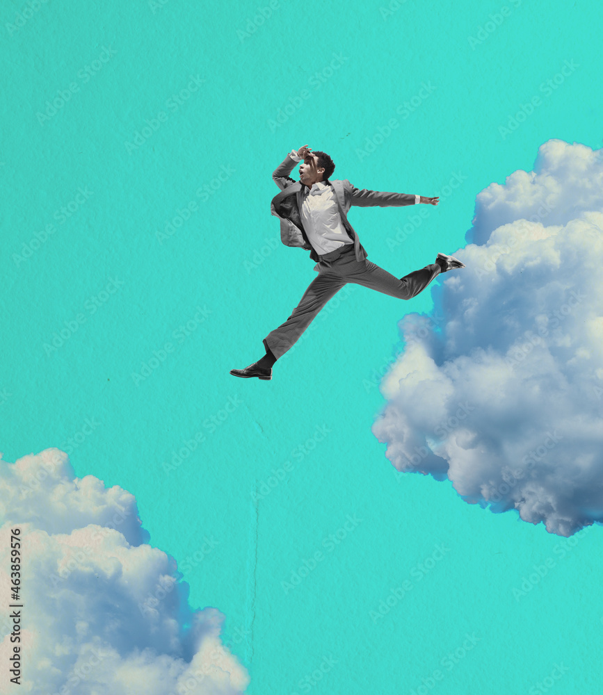 Young manager, finance analyst or clerk jumping, flying in his dreams isolated on light blue background. Collage Young manager, finance analyst or clerk jumping, flying in his dreams isolated on light blue background. Collage