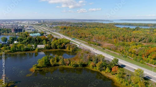 4K camera aerial drone view of Trans-Canada highway and fall season foliage colors in the outskirts of Montreal. photo