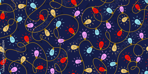 Christmas lights seamless repeat pattern, blue, yellow, red and pink lightbulbs on dark blue background
