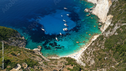 Aerial drone photo of iconic paradise bay and rocky beach of Erimitis in island of Paxos visited by luxury yachts and sail boats, Ionian, Greece
