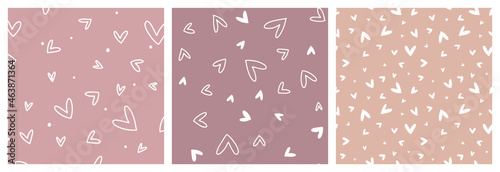 Heart non-directional seamless pattern set in soft pink, peach and mauve colours for feminine, toddler or teenager girl clothing. Hand drawn vector designs with love symbols.